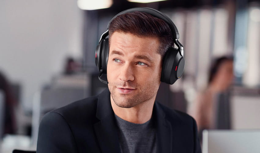 Man wearing a Jabra EVOLVE2 85 headset